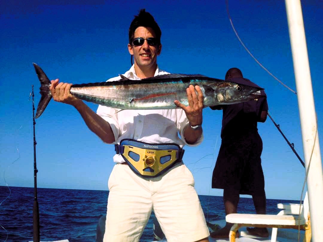 Catching a trophy fish like marlin or tuna on a Zanzibar fishing excursion