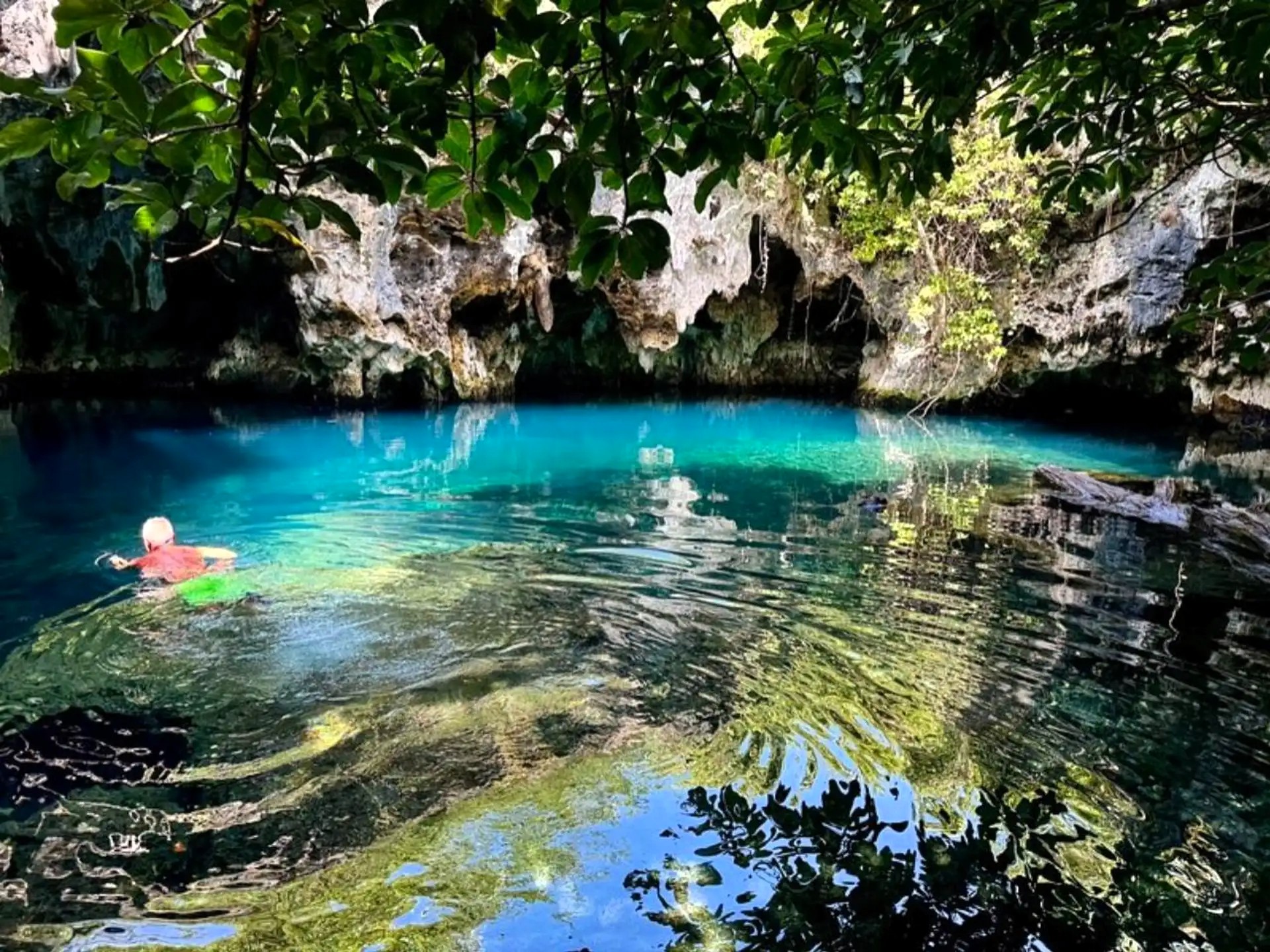 Crystal-clear freshwater pool inside Malum Cave, Zanzibar, believed to have healing properties